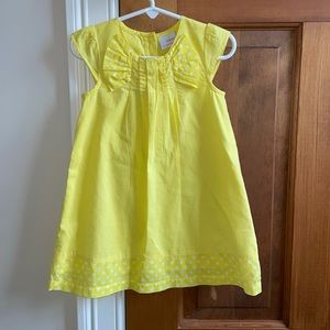 Next toddler girl’s bright yellow dress